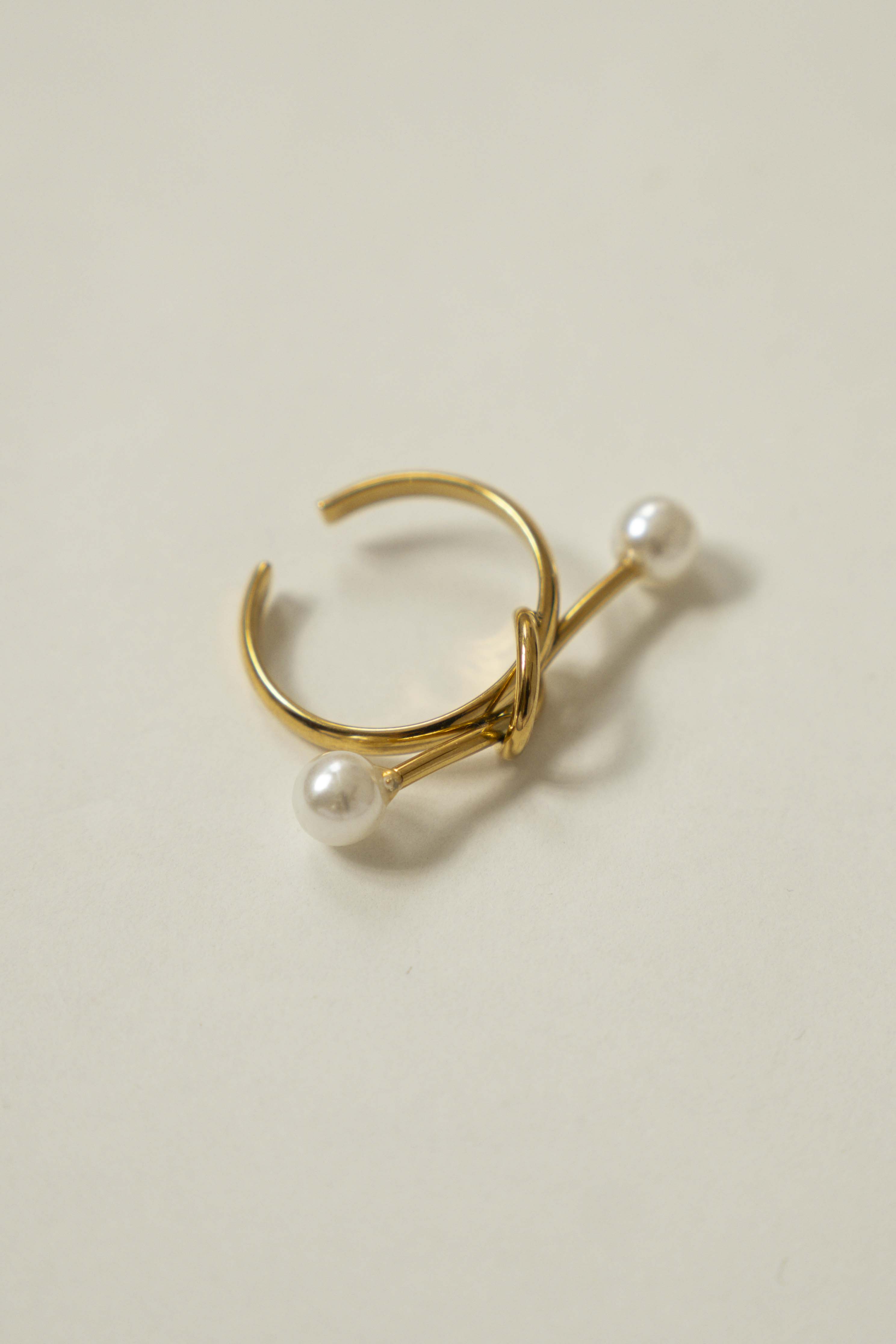 KNOT RING WITH DOUBLE PEARL