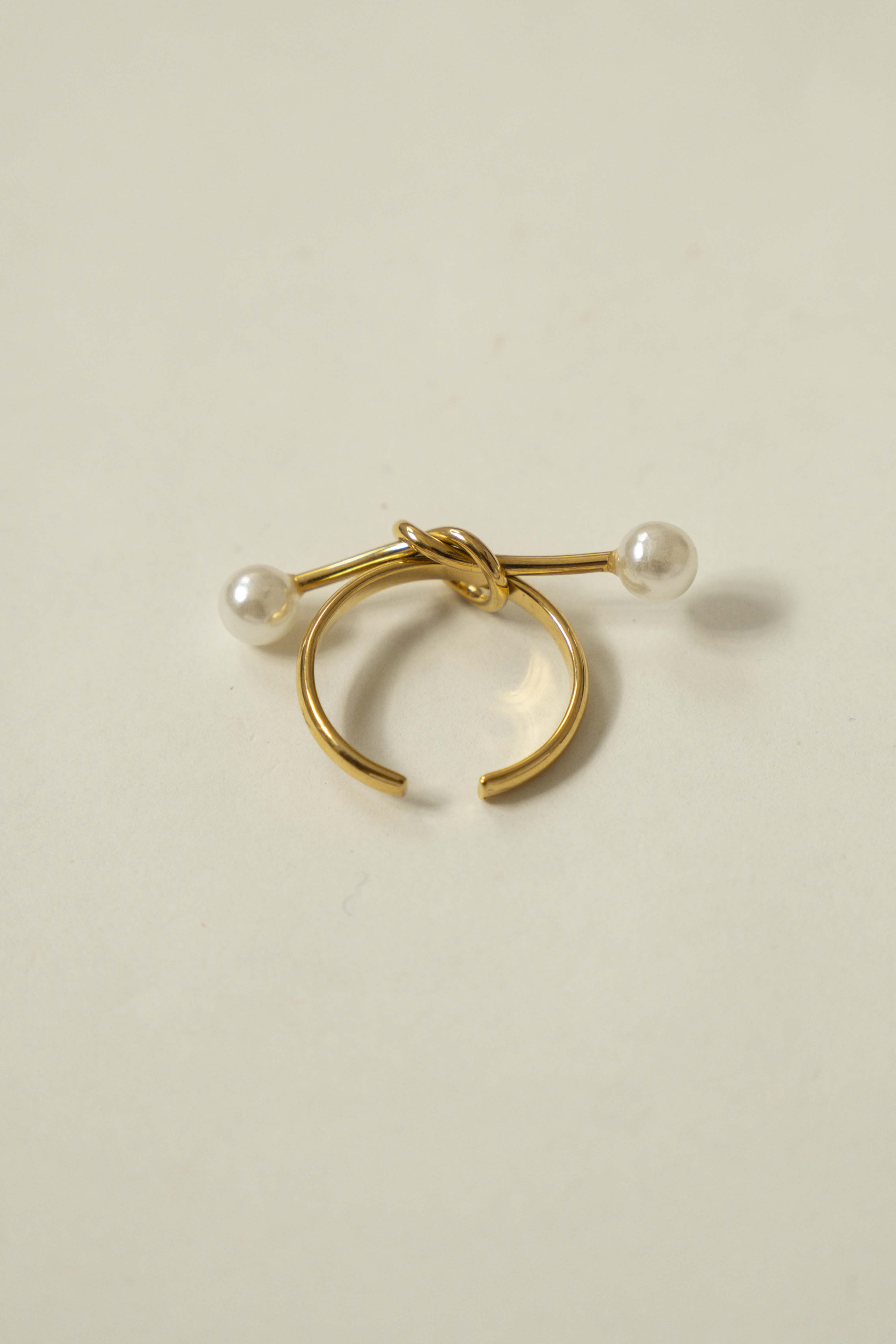 KNOT RING WITH DOUBLE PEARL